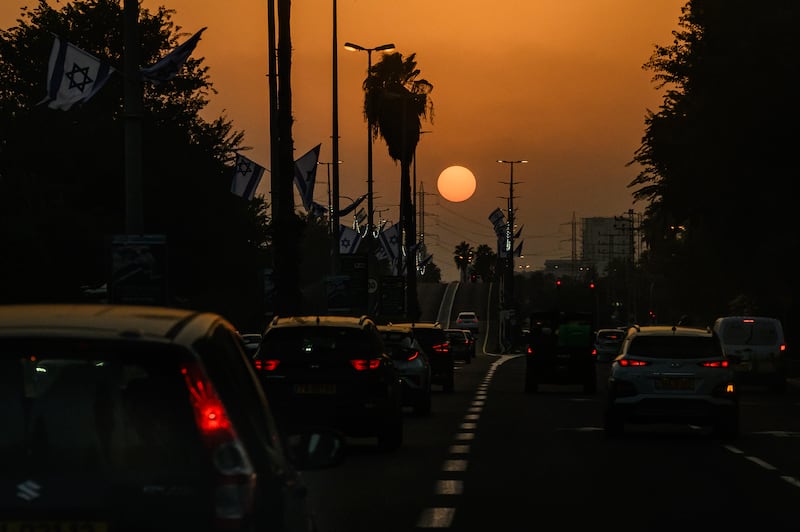 Sun begins to set in Tel Aviv, Israel. Photograph: Leon Neal/Getty Images