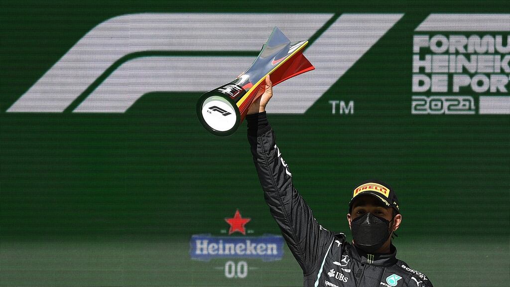 Mercedes’ Lewis Hamilton celebrates on the podium after winning the Portuguese Formula One Grand Prix. Photo: Patricia De Melo Moreira/AFP via Getty Images