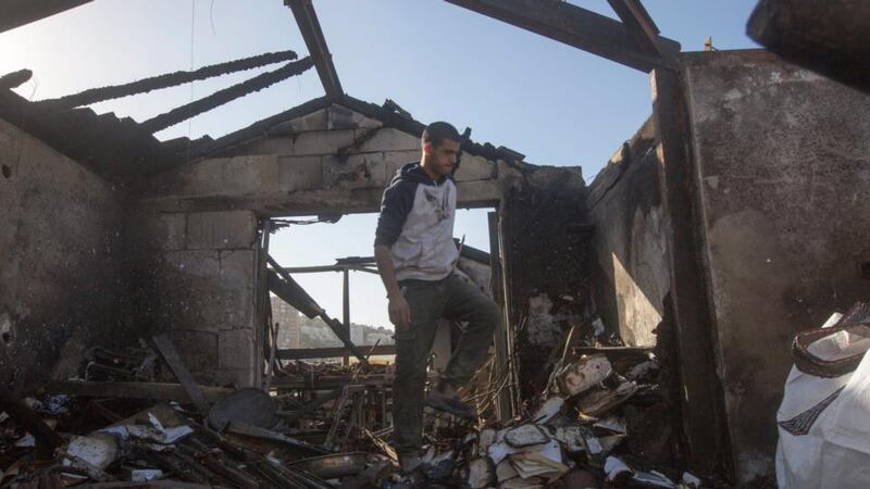An Israeli man inspects his burned house after a major fire swept the coastal city of Haifa, northern Israel, November 25th, 2016. Photograph: Atef Safadi/EPA