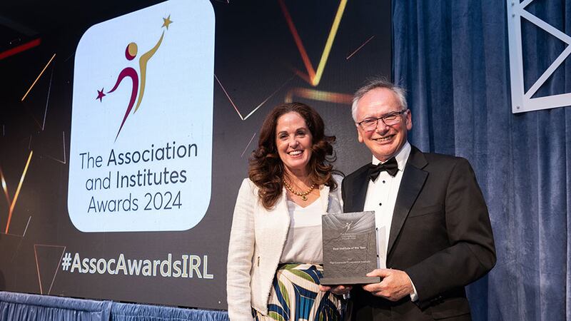 Angela Guillemet, awards judge, presents the best institute of the year awards to Willam Donnelly, awards judge on behalf of The Corporate Governance Institute