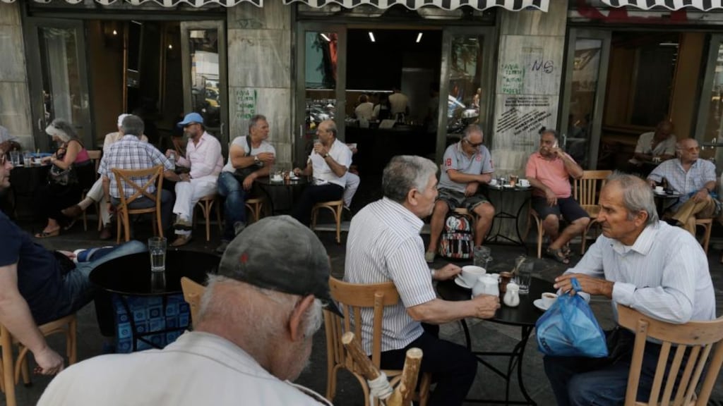 Athenians enjoy their coffee at a cafe, two days after the referendum. Photograph: Yannis Kolesidis/EPA