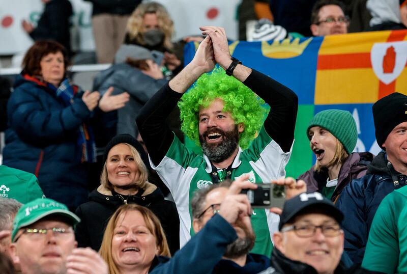 Delighted Ireland fans celebrate the victory over New Zealand at the
Forsyth Barr Stadium, Dunedin. Photograph: Billy Stickland/Inpho
