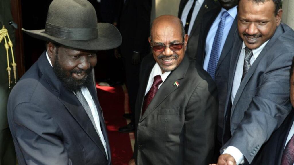President of South Sudan Salva Kiir (left) welcomes his Sudanese counterpart Omar al-Bashir (centre) in Juba, South Sudan, for talks to aid efforts for a ceasefire deal. Photograph: Phillip Dhil