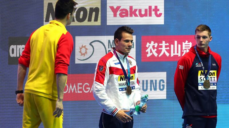 China’s gold medallist Sun Yang shouts “You’re loser, I’m a winner, yes!” to Britain’s Duncan Scott during the medal ceremony for the Men’s 200m Freestyle final. Photograph: Getty Images