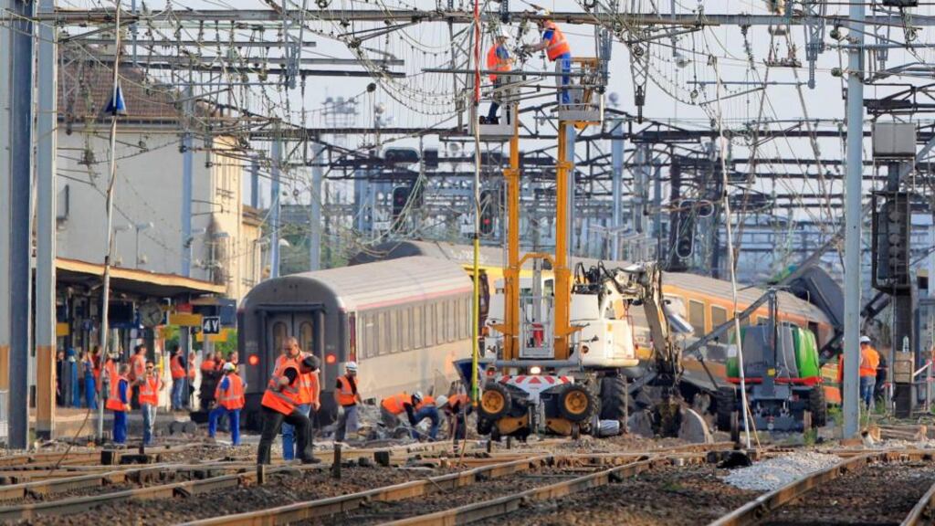 French railway employees and rescue workers inspect the wreckage of a derailed intercity train at the Bretigny-sur-Orge station near Paris on July 13th. Photograph: Reuters