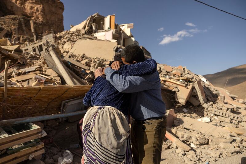 Family members react near the rubble of collapsed buildings in the village of Imi N'Tala near Amizmiz. Photograph: Fadel Senna/AFP via Getty Images