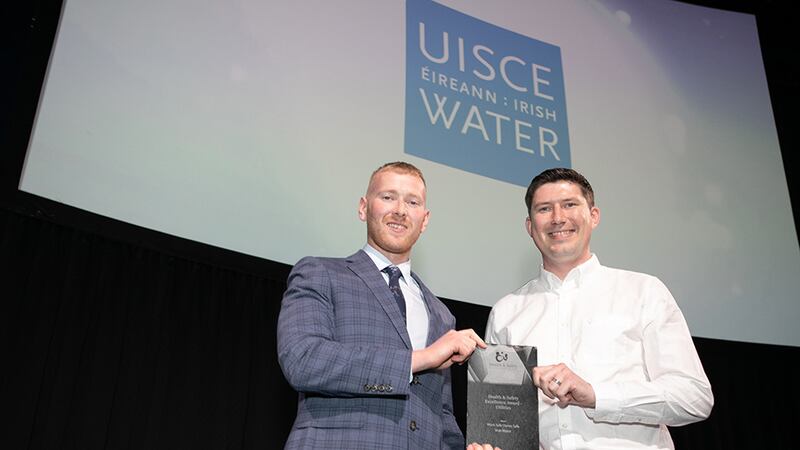Neil Wall, Head of Entries at BusinessRiver, presents Health & Safety Excellence Award - Utilities to Liam Dowling, Irish Water.