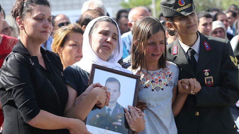 The wife and  daughter  of Turkish Major Yavuz Sonat Guzel, killed in a Kurdistan Workers’ Party (PKK) attack in the province of Tunceli, at his funeral in  Kocatepe Mosque in Ankara on September 27th. Photograph: Adem Altan/AFP/Getty Images