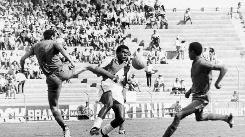 Moroccan defender Khanousi Moulay Idriss challenges Peru’s Teofilo Cubillas at the 1970 World Cup. Photograph: Getty Images