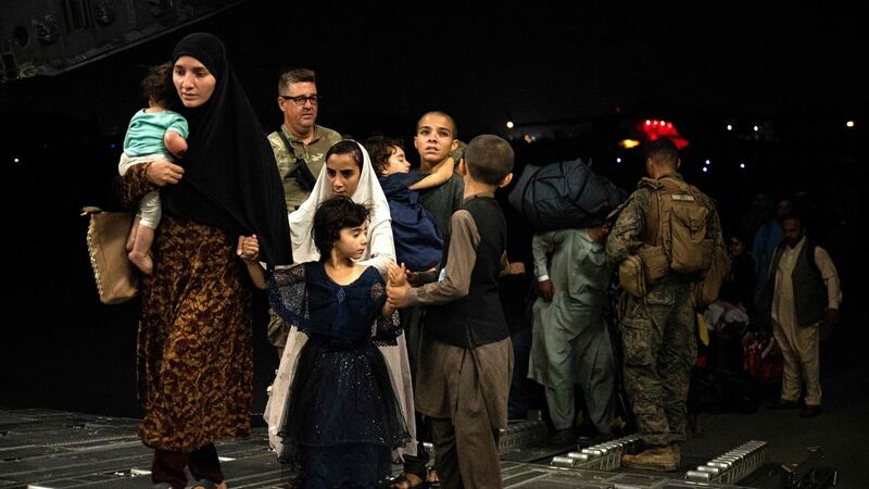 Civilians from Afghanistan evacuated by the US military arrive at an undisclosed location on August 19th. Photograph: Brandon Cribelar/US Central Command Public Affairs/AFP via Getty Images