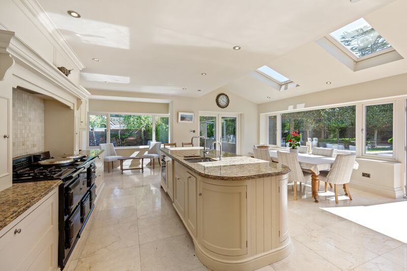 Kitchen, living and dining area is the hub of this six-bedroom home