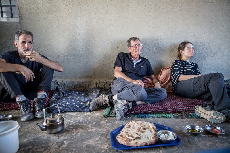 Israeli activist Kobi Snitz (left) sits with other activists in the home of a Palestinian shepherd in the South Hebron Hills. Photograph: Sally Hayden