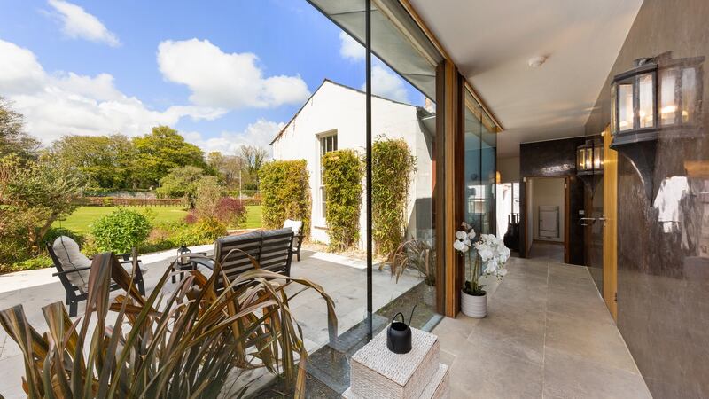The annex with floor-to-ceiling windows