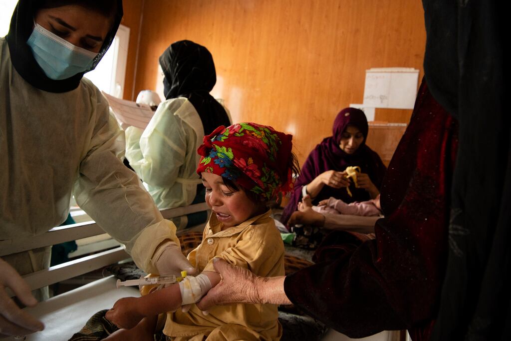 Nurses treat a measle patient in the intensive care ward of a hospital in Herat, Afghanistan, in March 2022. Since the Taliban administration banned women from aid work, many groups have suspended their operations in the country and warned of permanently shutting down if the ban remains. Photograph: Kiana Hayeri/The New York Times