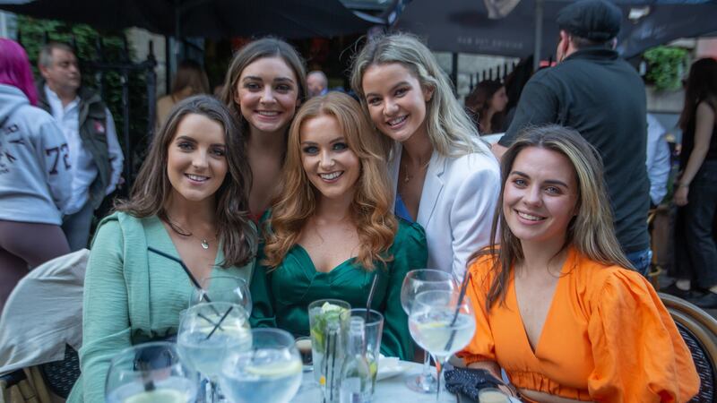 Ali Aherne-Hurley (back right in white) and friends from Cork out on South William Street in Dublin. Photograph: Gary Ashe