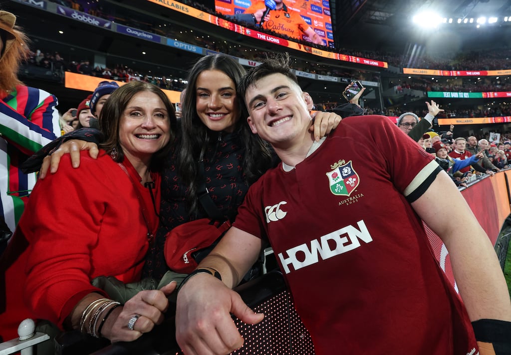 Lion's Dan Sheehan celebrates after the game with his mam Sinead Sheehan and girlfriend Katherine Egan. Photograph: Billy Stickland/Inpho