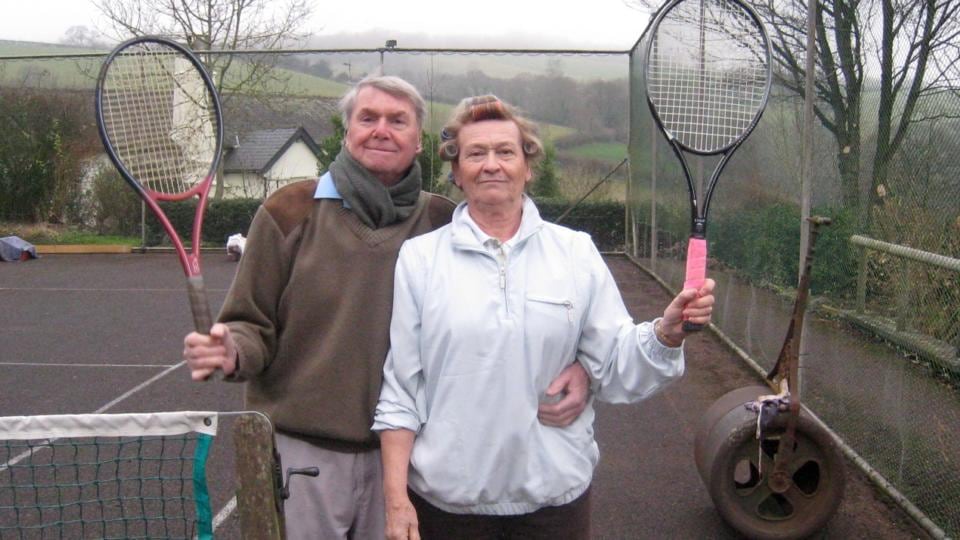 Margaret and Graham Smith on the tennis court at home on Lurcombe Farm in the UK