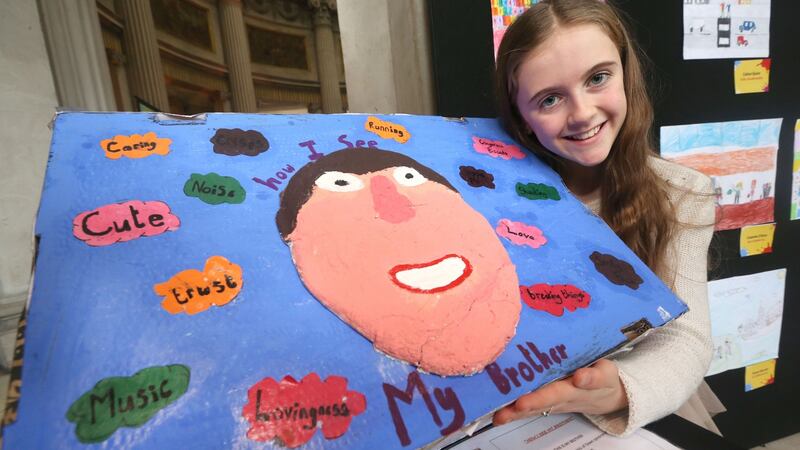 Maeve Allen from Ballinderry NS, Co Galway with artwork dedicated to her brother Liam, was a finalist in the ‘Someone Like Me’ national art competition. Photograph: Finbarr O’Rourke