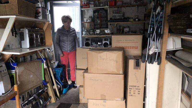 Eileen Staunton makes storage space in her garage for goods being shipped to Poland at the end of the week. Photograph: Mark Hilliard