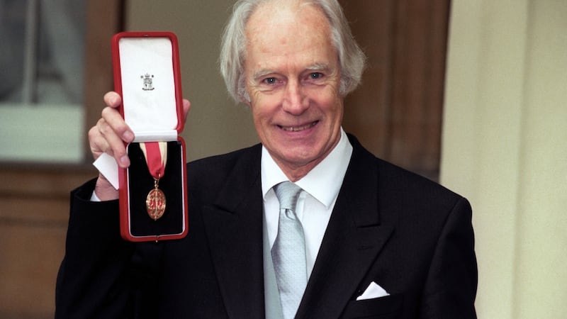File photograph from 1996 showing  Sir George Martin with his Knighthood at Buckingham Palace, London. Photograph:   Neil Munns/PA Wire