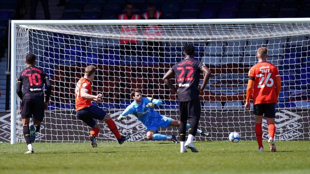 Luton Town’s James Collins scores the opening goal from the penalty spot during the Championship win over Watford at Kenilworth Road. Photo: Tess Derry/PA Wire