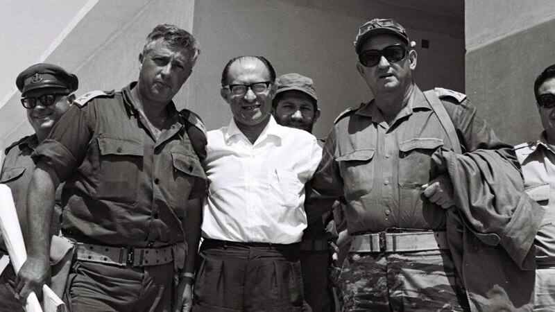 Israel’s then defence minister Ariel Sharon (left) with then prime minister Menachem Begin (centre) and Gen Avraham Yoffe (right) in Jebel Livne in the Sinai, Egypt, in June 1977. Photograph: EPA/Israeli ministry of defense