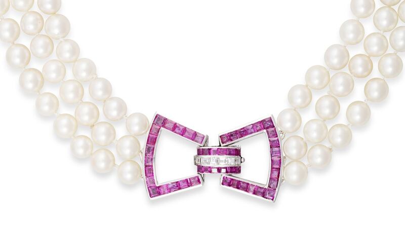 Three-strand pearl necklace with ruby and diamond clasp from Adam’s, (Lot 136, estimate €2,500 to €3,500)