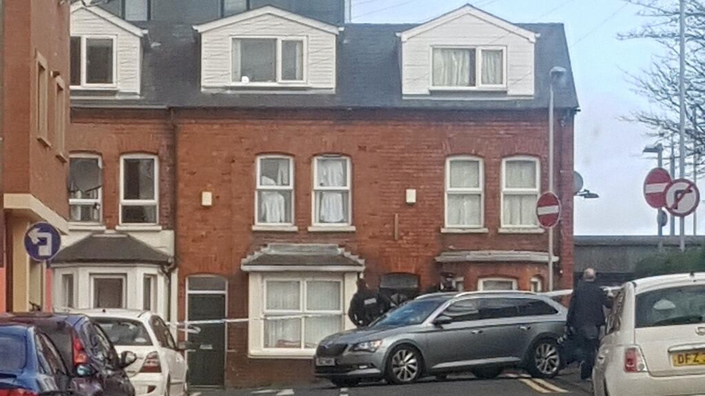 Police near the scene of an ongoing incident in Belfast. Photograph: Maria Lyttle/PA Wire