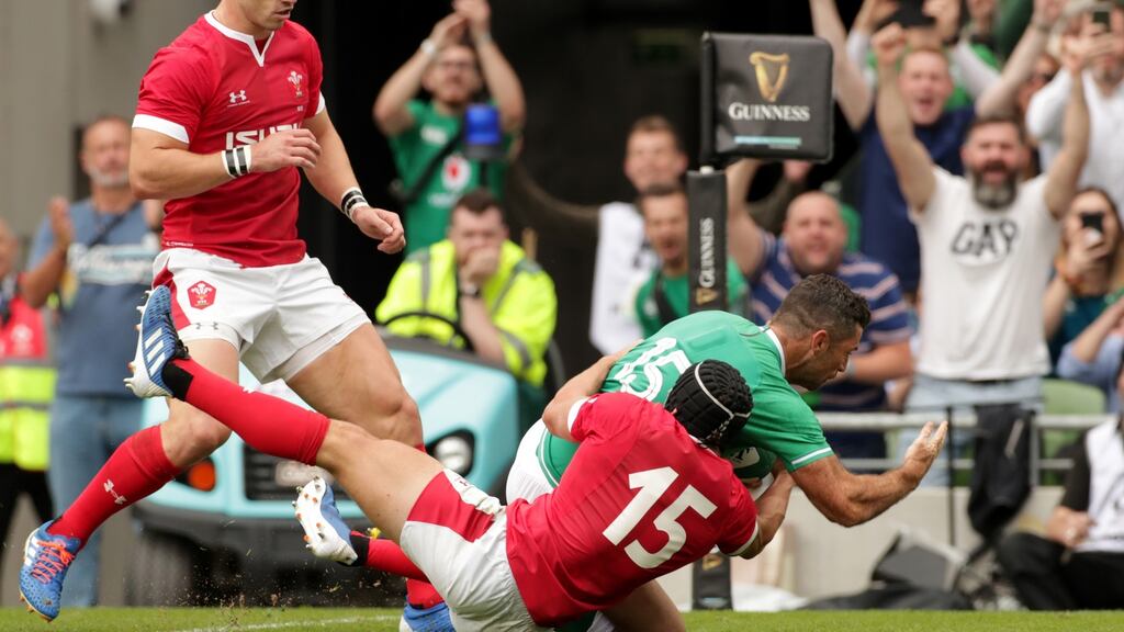 Ireland’s Rob Kearney scores a try against Wales. The fullback is expected to miss the match against Scotland with a hamstring injury. Photograph: Billy Stickland/Inpho