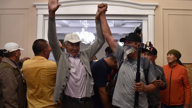 Supporters of former Kyrgyz president Almazbek Atambayev guarding his house during a raid by special forces on Wednesday. Photograph: Vyacheslav Oseledko/AFP/Getty Images