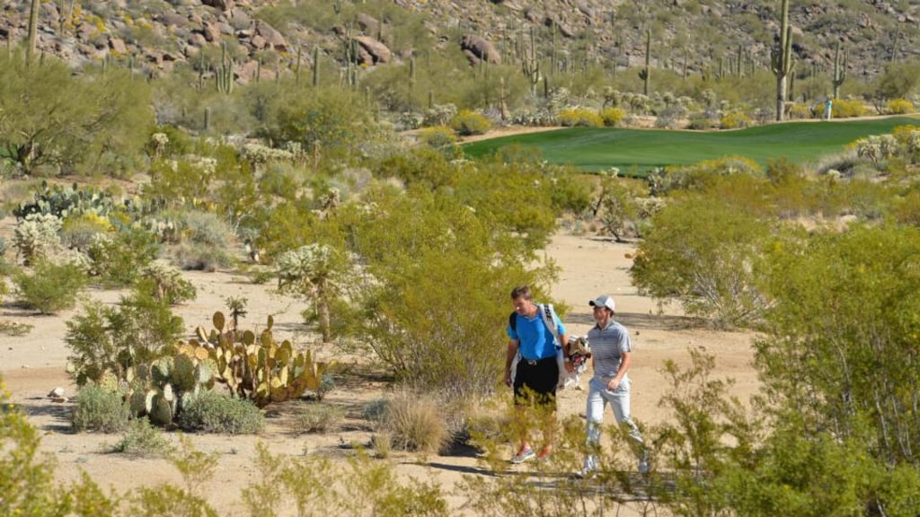 Rory McIlroy walks through the desert during practice prior to the start of the World Golf Championships Match Play at Dove Mountain in Arizona. Photograph: Stuart Franklin/Getty Images