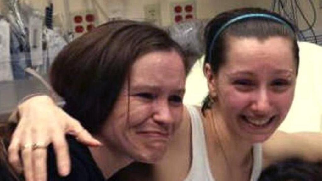 Amanda Berry (right) hugs her sister Beth Serrano after being reunited in a Cleveland hospital on Monday. Photograph: AP Photo Amber Berry hugs her sister Beth Serrano after being reunited in a Cleveland hospital Monday May 6, 2013. (AP Photo/Family Handout courtesy WOIO-TV)