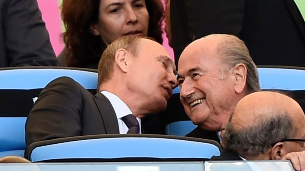 Russian president Vladimir Putin and then to Fifa president Sepp Blatter during the 2014 World Cup final between Germany and Argentina at the Maracana stadium in Rio. Photograph: Reuters/Dylan Martinez