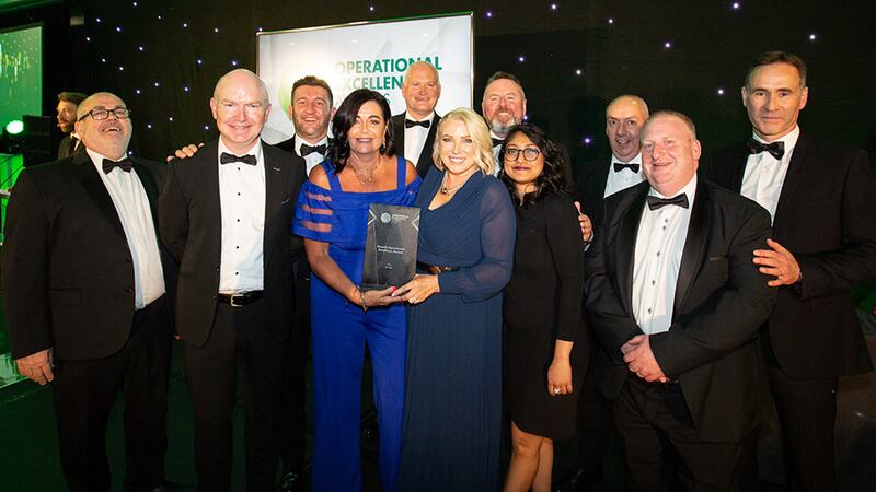 Eugene Bortolozzo, CEO at Business River, presents the Overall Operational Excellence Award to An Post team.