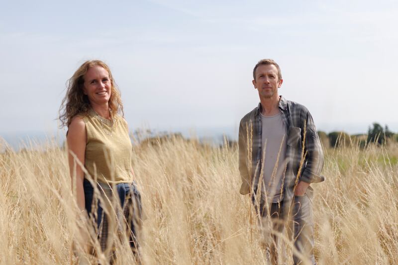 Anke and John Moran in their rewilded native woodland near Glen of the Downs, Co Wicklow. Photograph: Dan Dennison