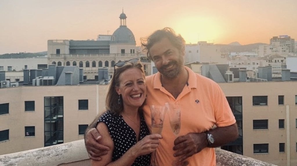 Liz Golden and Jorge Fuster Escobar raise a glass to life and love on the night they got engaged under a setting sun in Palma de Mallorca, Spain