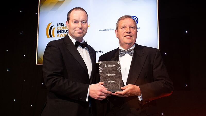 Paul Mangan, Awards Judge presents the Project Manager of the Year award to John Gavigan, P.J. Hegarty & Sons.