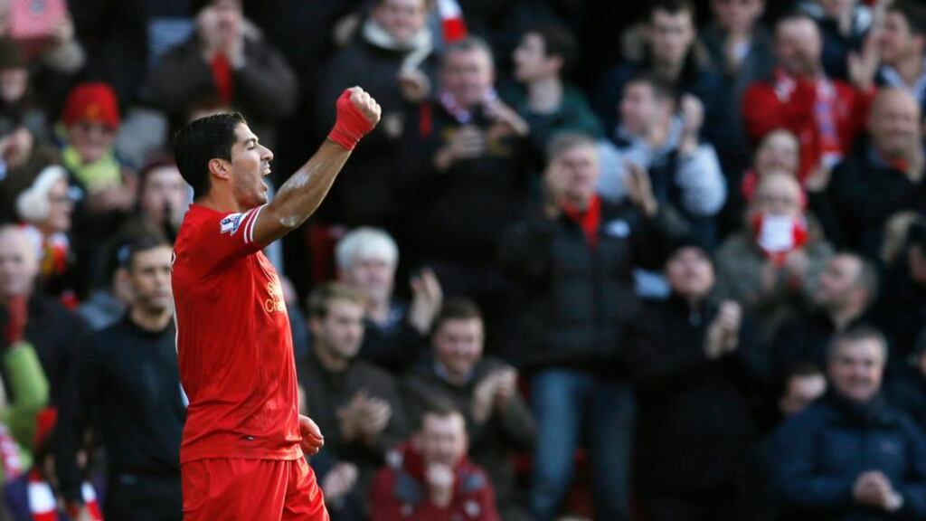 Liverpool’s Luis Suarez celebrates after scoring against Cardiff City. Photograph: Phil Noble/Reuters
