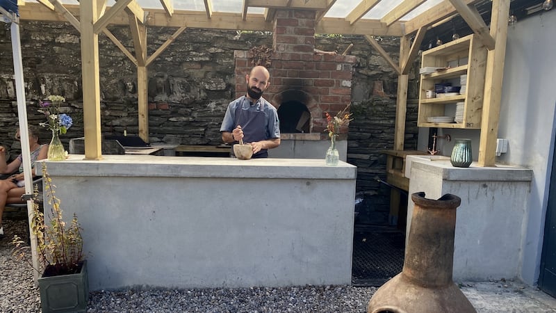 Chef Ahmet Dede in the barbecue area of his restaurant, Dede, in Baltimore. Photograph: Corinna Hardgrave