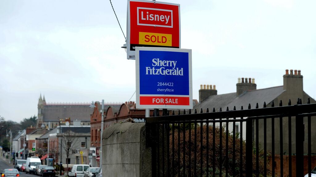Auctioneers’ signs in Sandycove, Co Dublin. The four-decade long boom in house prices – apart from the short-lived decline after 2008 – coincides with a period of historically low interest rates. Photograph: Cyril Byrne