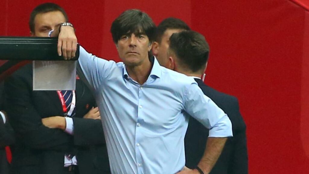 German coach Joachim Löw watches events unfold during the 2-0 loss to Poland in Warsaw. Photograph: Alexander Hassenstein/Bongarts/Getty Images.