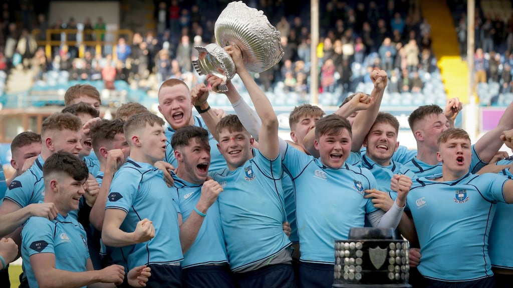 St Michael’s Mark Hernan lifts the trophy after they beat Gonzaga to claim the Senior Cup title. Photo: Oisin Keniry/Inpho