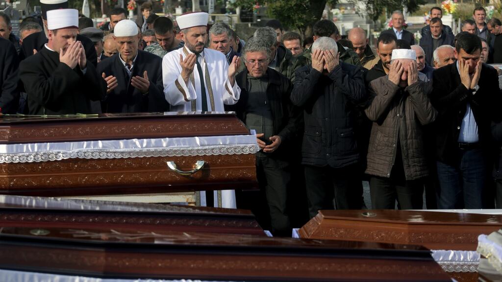 Imams of the Muslim community in Albania reads the last rites during the funeral ceremony of eight Lala family members after an earthquake hit Durres, Albania. Eight members of the Lala family were among 51 victims of the quake that hit on Tuesday. Photograph: Malton Dibra/EPA