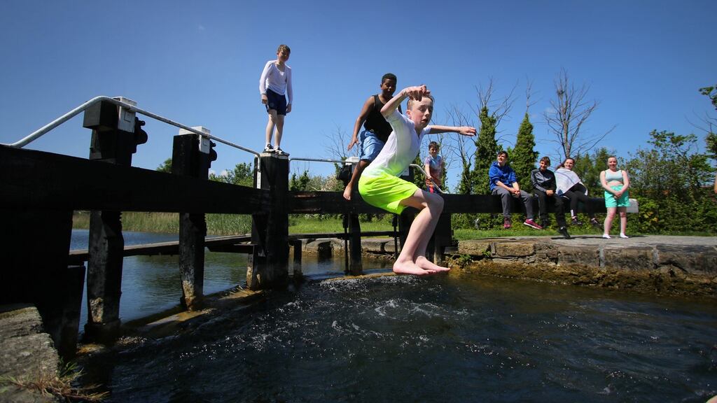 Youths jump into the water at Black Horse Bridge area of the Grand Canal in Inchicore, Dublin in May. Photograph: The Irish Times