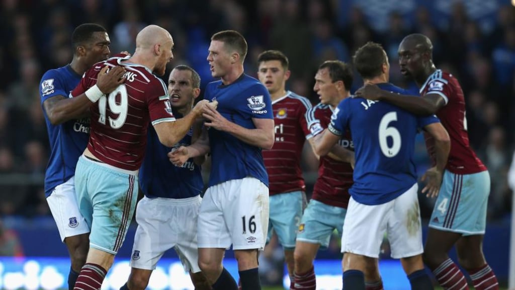 James Collins of West Ham United confronts Everton’s James McCarthy during the Premier League match at Goodison Park. Photo: Chris Brunskill/Getty