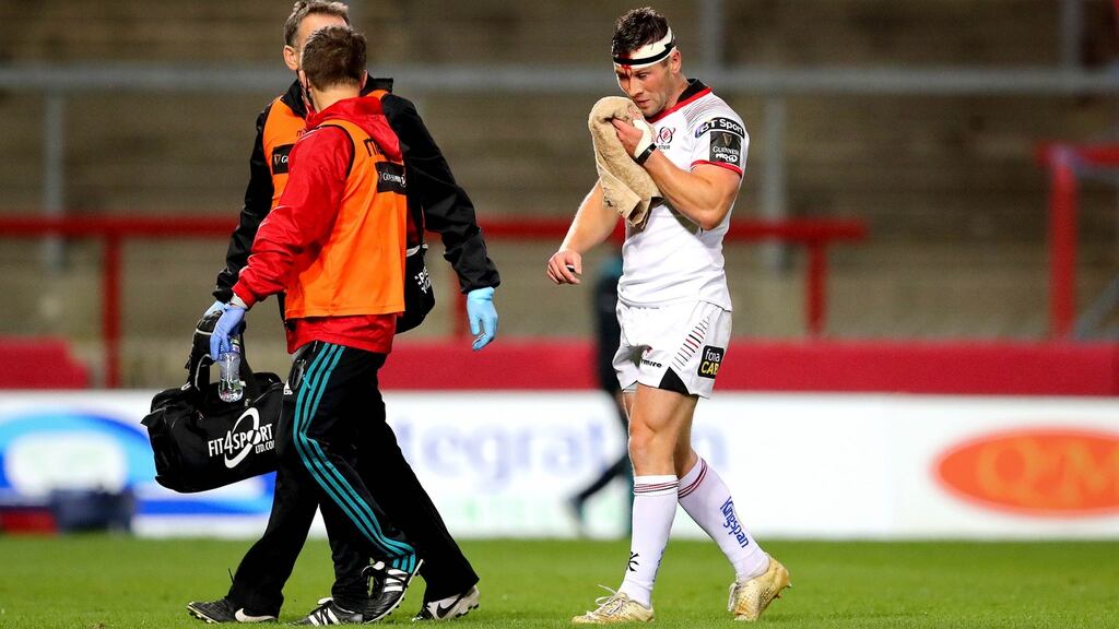 Ulster’s John Cooney departs the action at Thomond Park having suffered a head injury against Munster. Photograph: Ryan Byrne/Inpho