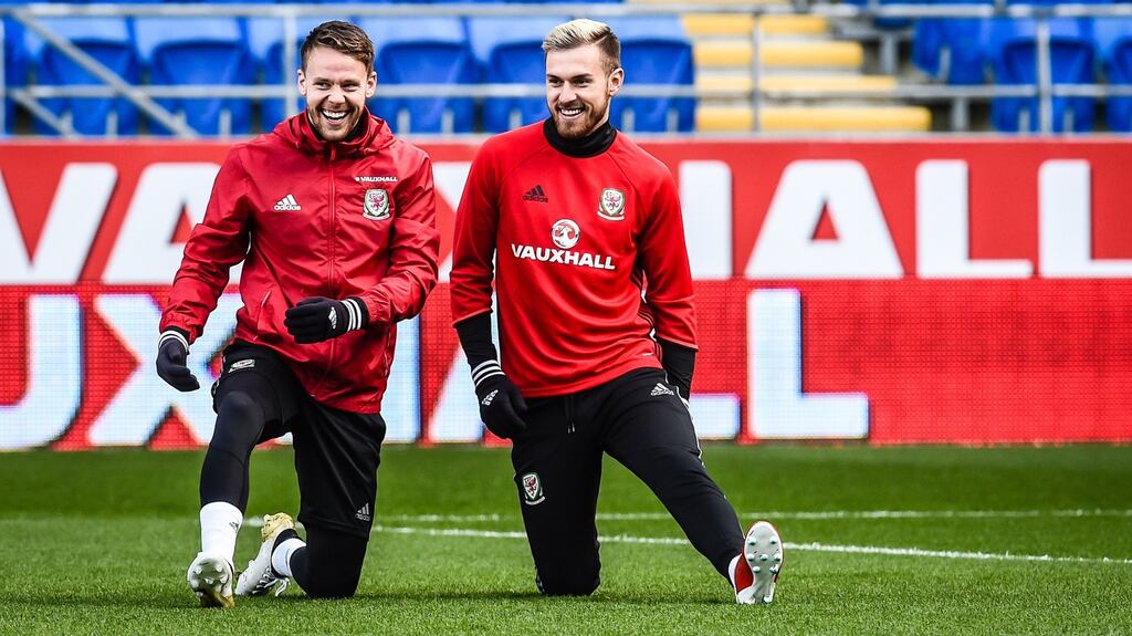 Wales’ Chris Gunter and Aaron Ramsey stretch out during a training session at Cardiff City Stadium on Friday ahead of the World Cup qualifier against Serbia. Photograph: Ben Birchall/PA Wire