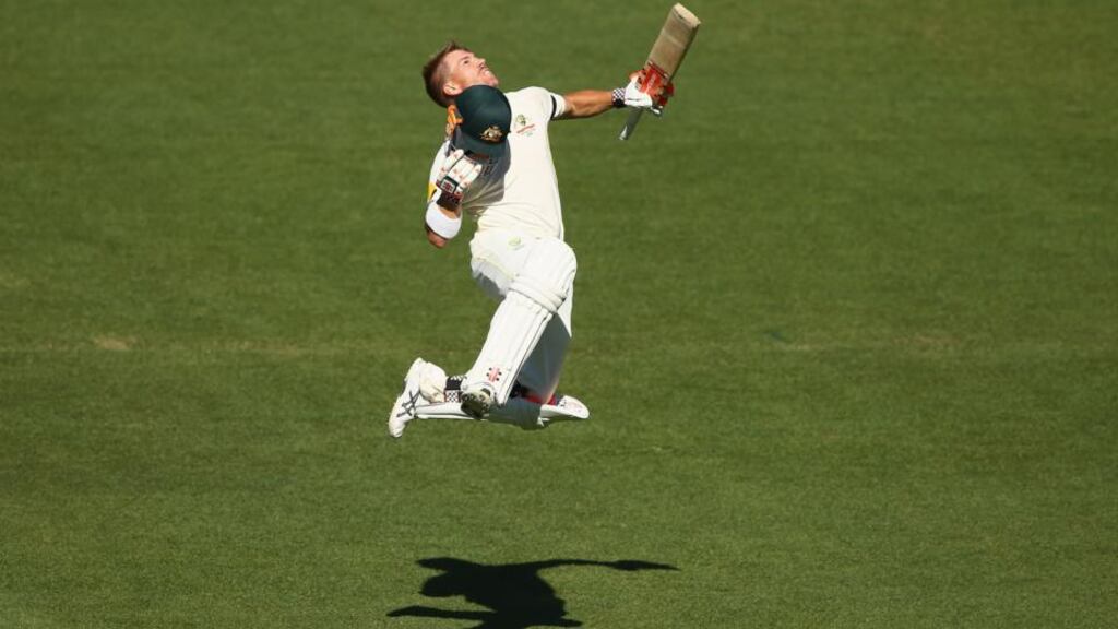 Australia’s David Warner celebrates scoring his second century of the first Test against India in Adelaide. Photograph:   Robert Cianflone/Getty Images