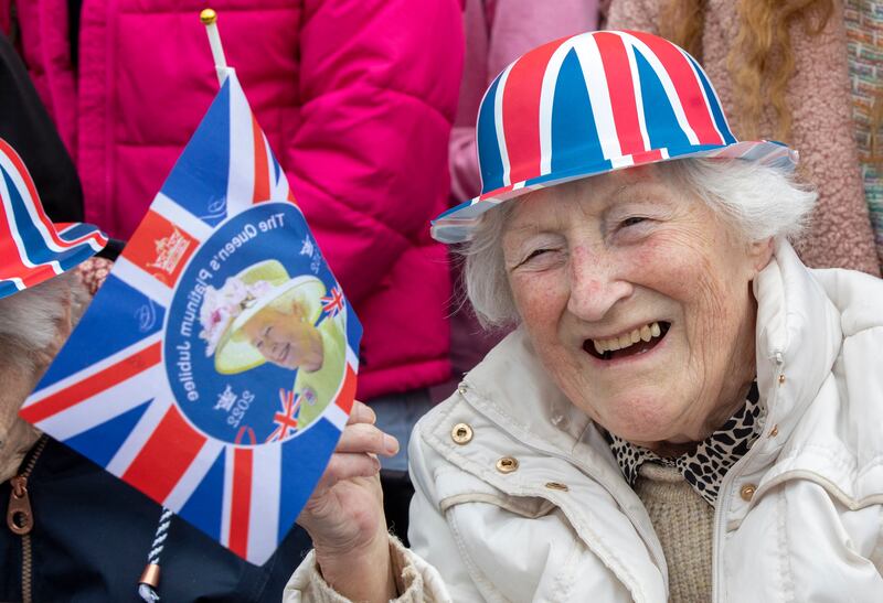 Members of the public gather outside Hillsborough Castle in Belfast in advance of the visit by Britain's King Charles III. Photograph: Paul Faith/AFP via Getty Images
