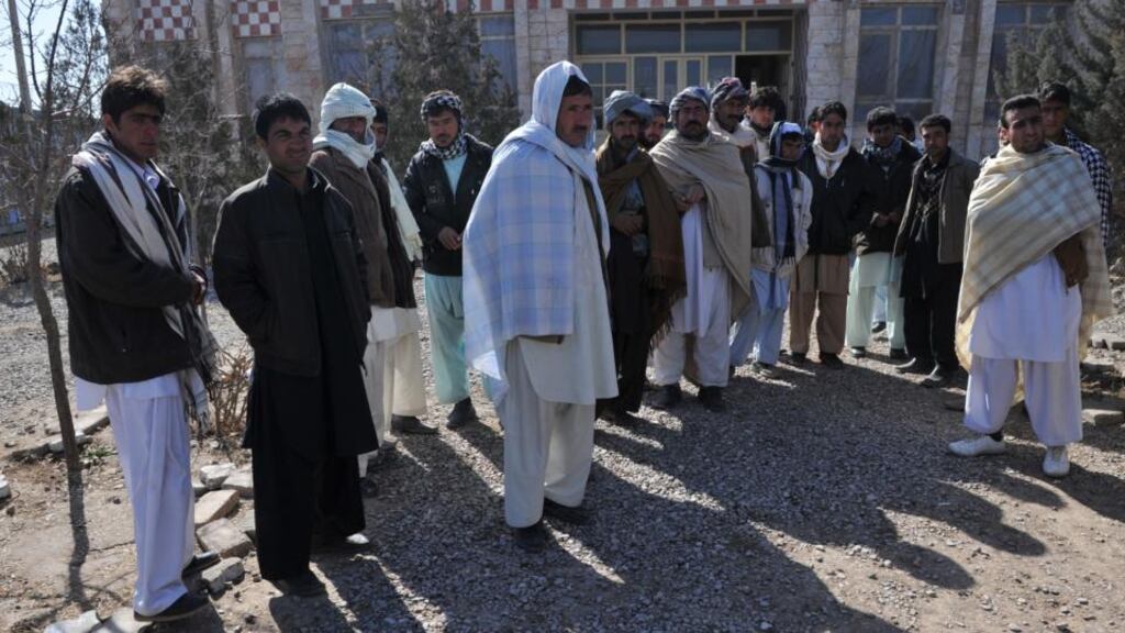 Afghan men who were deported from Iran to Afghanistan look on at the provincial refugee agency premises in Herat city earlier this year. Photograph: Massoud Hossaini/AFP/Getty Images